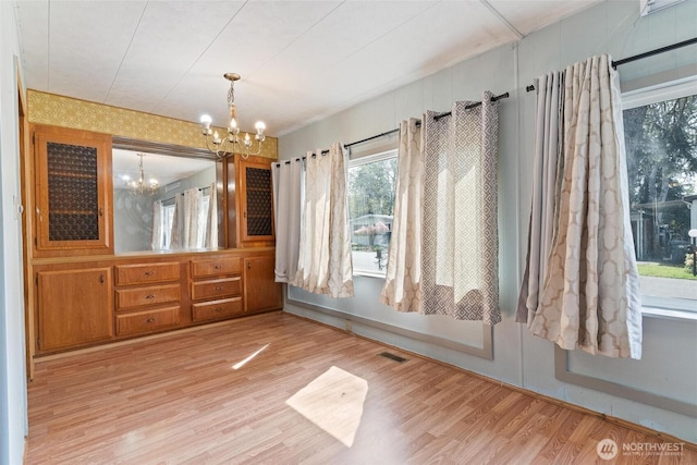 3213 85th St S Unit 48, Lakewood, WA 98499 - unfurnished dining area featuring a chandelier and wood finished floors