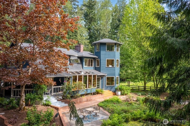 3246 Goshen Rd, Bellingham, WA 98226 - rear view of property with a chimney and a patio