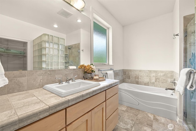 4415 Harborview Dr, Blaine, WA 98230 - full bath with a stall shower, a bath, vanity, and recessed lighting