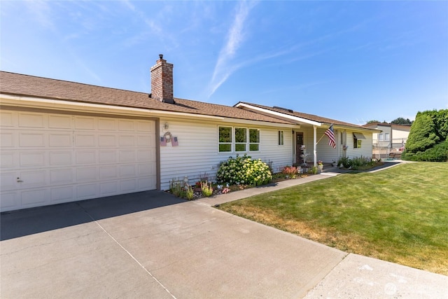 695 S Lyle Ave, East Wenatchee, WA 98802 - ranch-style house featuring concrete driveway, a chimney, a front lawn, and a garage
