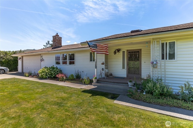 695 S Lyle Ave, East Wenatchee, WA 98802 - view of front of property featuring an attached garage, a front yard, a chimney, and covered porch