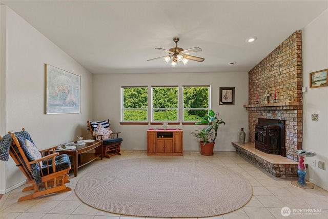 695 S Lyle Ave, East Wenatchee, WA 98802 - living area featuring light tile patterned floors, a ceiling fan, a wood stove, and recessed lighting