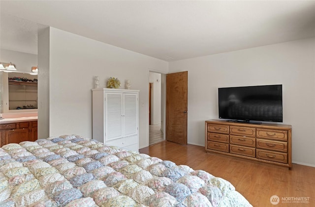 695 S Lyle Ave, East Wenatchee, WA 98802 - bedroom with light wood finished floors and ensuite bath