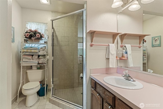 695 S Lyle Ave, East Wenatchee, WA 98802 - full bath with vanity, tile patterned flooring, and a shower stall