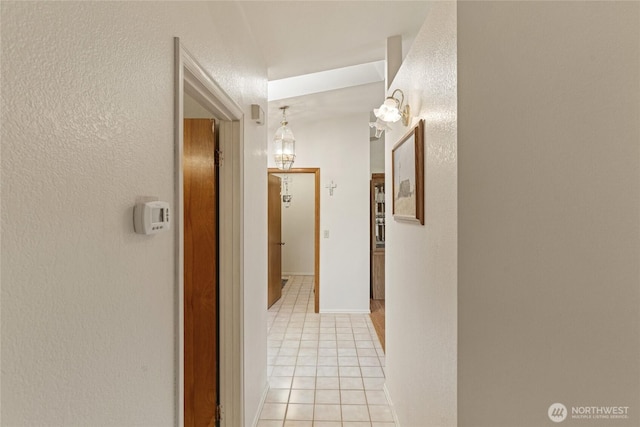 695 S Lyle Ave, East Wenatchee, WA 98802 - hallway featuring light tile patterned floors and a textured wall