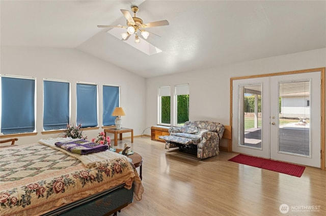 695 S Lyle Ave, East Wenatchee, WA 98802 - bedroom with access to exterior, french doors, lofted ceiling, light wood-type flooring, and a skylight
