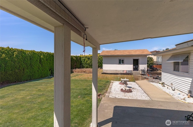 695 S Lyle Ave, East Wenatchee, WA 98802 - view of green lawn with an outdoor structure and a patio