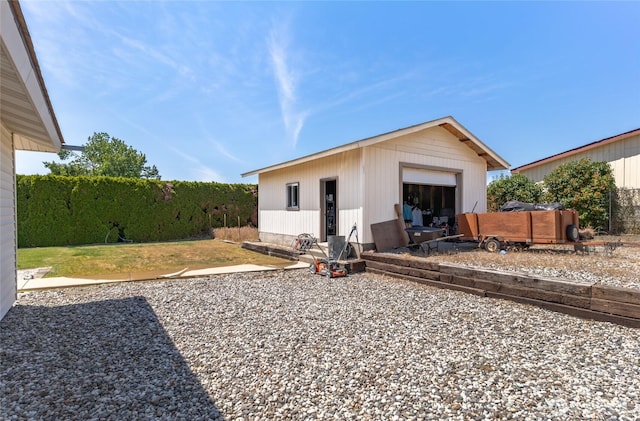 695 S Lyle Ave, East Wenatchee, WA 98802 - rear view of house with an outdoor structure and a detached garage