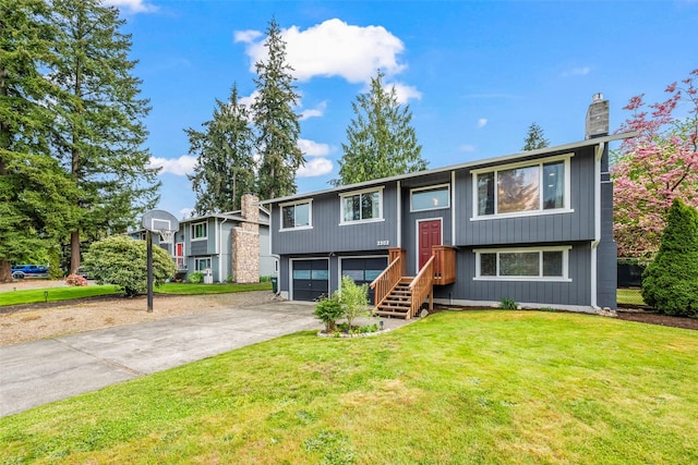 2202 28th Ave SE, Puyallup, WA 98374 - split foyer home with driveway, a chimney, a front lawn, and a garage