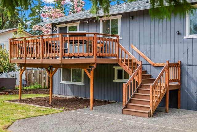 2202 28th Ave SE, Puyallup, WA 98374 - rear view of property featuring a deck, a shingled roof, and stairway