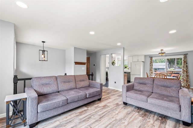 2202 28th Ave SE, Puyallup, WA 98374 - living room with recessed lighting, light wood-style floors, and baseboards