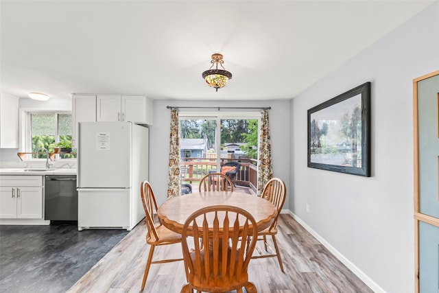 2202 28th Ave SE, Puyallup, WA 98374 - dining space with healthy amount of natural light, wood finished floors, and baseboards