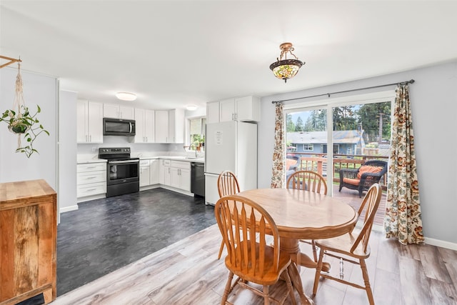 2202 28th Ave SE, Puyallup, WA 98374 - dining space with dark wood-type flooring and baseboards
