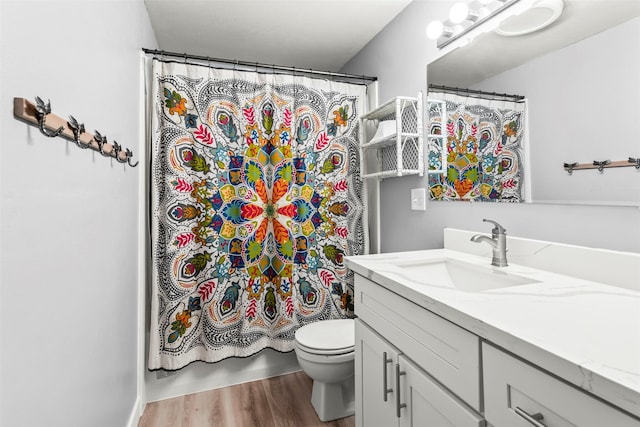 2202 28th Ave SE, Puyallup, WA 98374 - full bath with wood finished floors, toilet, and vanity