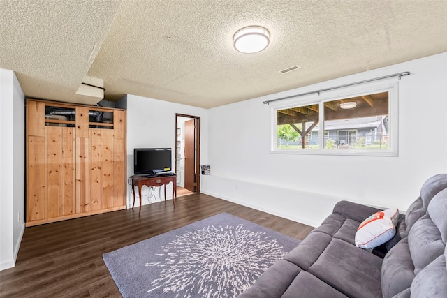 2202 28th Ave SE, Puyallup, WA 98374 - living area featuring wood finished floors, a textured ceiling, and baseboards