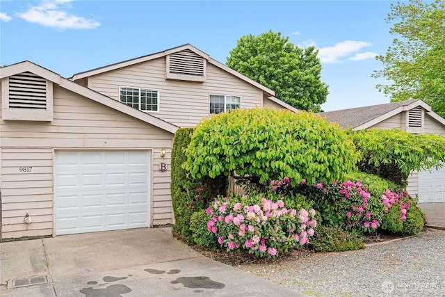 9817 132nd Street Ct E Unit B, Puyallup, WA 98373 - view of front facade with concrete driveway and a garage