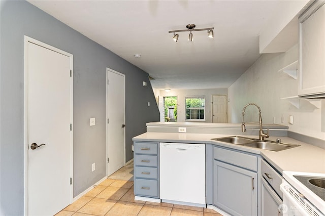 9817 132nd Street Ct E Unit B, Puyallup, WA 98373 - kitchen featuring white appliances, a sink, a peninsula, open shelves, and light countertops