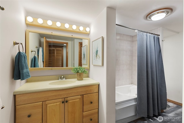 bathroom with shower / bath combo and vanity