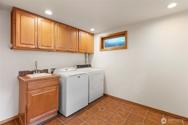 laundry room featuring cabinet space, separate washer and dryer, recessed lighting, baseboards, and dark tile patterned flooring