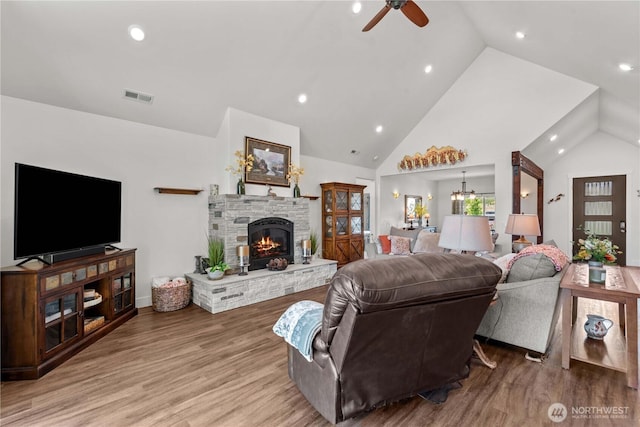 179 N Shore Dr, Orondo, WA 98843 - living room with ceiling fan, wood finished floors, a fireplace, recessed lighting, and high vaulted ceiling