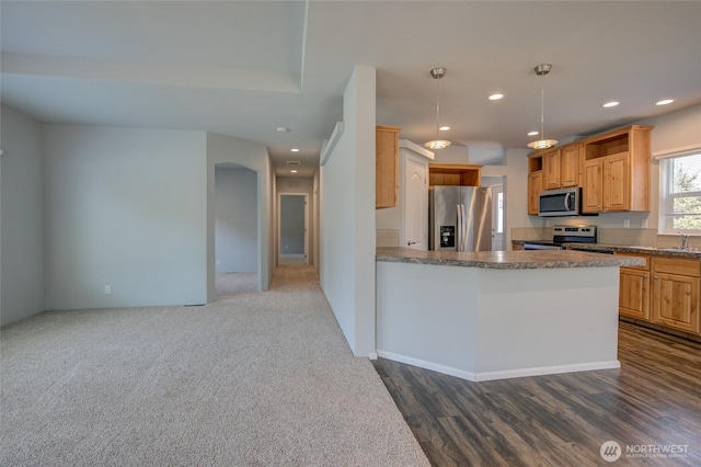 114 Mark Ct SE, Ocean Shores, WA 98569 - kitchen with appliances with stainless steel finishes, recessed lighting, a sink, dark wood-style floors, and pendant lighting