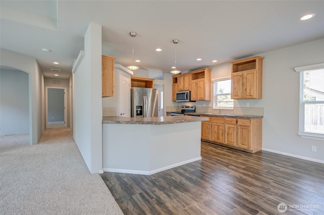 114 Mark Ct SE, Ocean Shores, WA 98569 - kitchen with stainless steel appliances, recessed lighting, dark wood-type flooring, a peninsula, and arched walkways