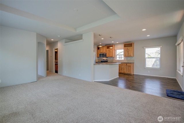 114 Mark Ct SE, Ocean Shores, WA 98569 - unfurnished living room with dark carpet and recessed lighting