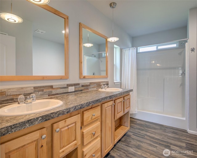 114 Mark Ct SE, Ocean Shores, WA 98569 - full bathroom featuring curtained shower, double vanity, and wood finished floors