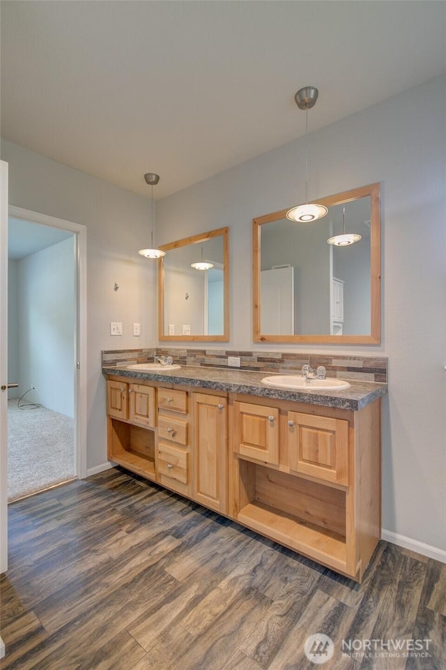 114 Mark Ct SE, Ocean Shores, WA 98569 - full bathroom featuring wood finished floors, double vanity, and baseboards