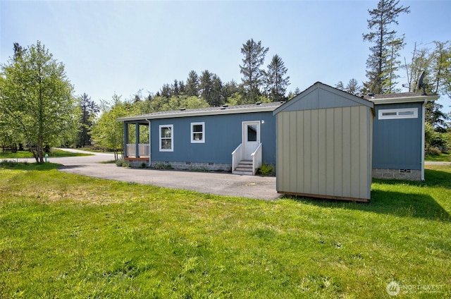 114 Mark Ct SE, Ocean Shores, WA 98569 - back of house with entry steps, crawl space, and a lawn