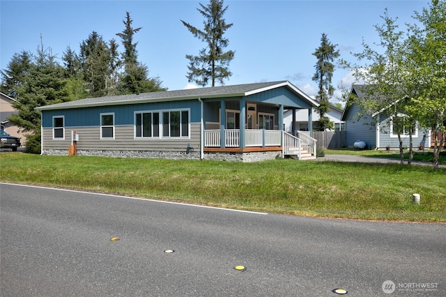 114 Mark Ct SE, Ocean Shores, WA 98569 - view of front of home with a porch and a front yard