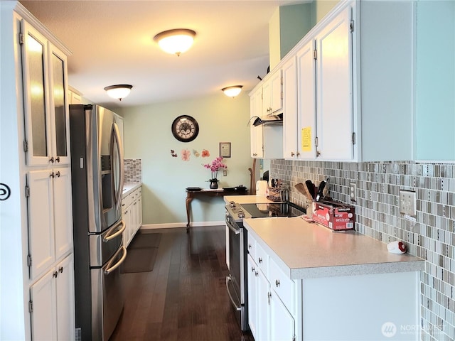 10409 137th St E Unit 9, Puyallup, WA 98374 - kitchen with stainless steel appliances, tasteful backsplash, light countertops, white cabinetry, and baseboards