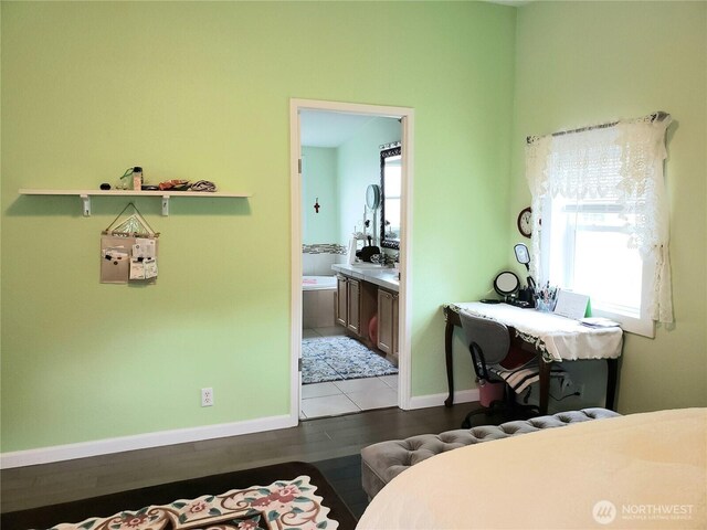 10409 137th St E Unit 9, Puyallup, WA 98374 - bedroom with baseboards, wood finished floors, and ensuite bathroom