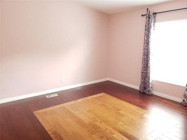 10409 137th St E Unit 9, Puyallup, WA 98374 - empty room with baseboards and wood finished floors