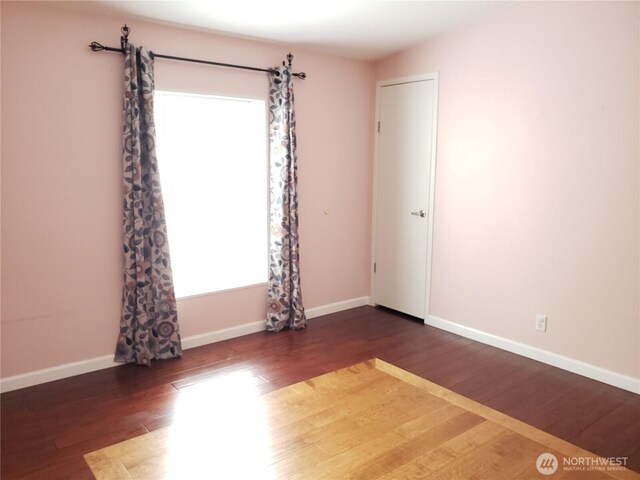 10409 137th St E Unit 9, Puyallup, WA 98374 - empty room featuring wood finished floors and baseboards