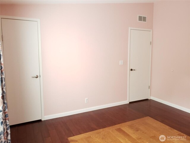 10409 137th St E Unit 9, Puyallup, WA 98374 - unfurnished room with dark wood-type flooring and baseboards