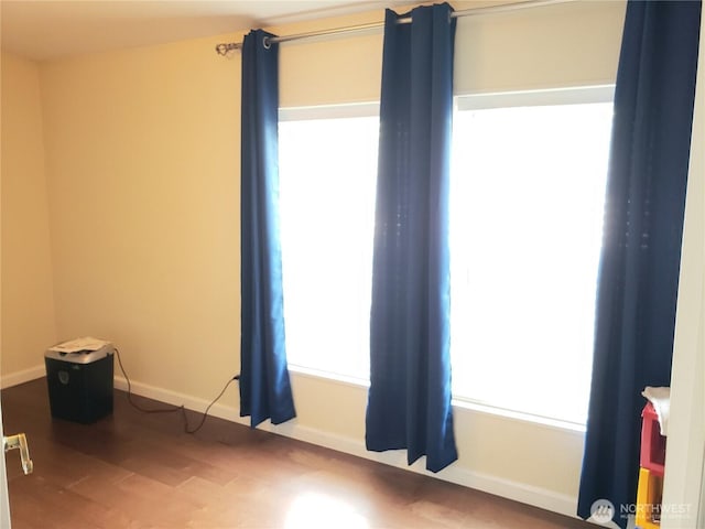 10409 137th St E Unit 9, Puyallup, WA 98374 - spare room with wood finished floors and baseboards