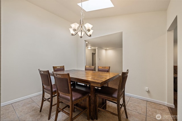 5510 83rd Ave W, University Place, WA 98467 - dining area featuring a skylight, a chandelier, light tile patterned floors, baseboards, and lofted ceiling