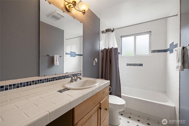 5510 83rd Ave W, University Place, WA 98467 - full bath featuring toilet, shower / bath combo with shower curtain, vanity, and a textured wall