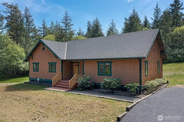 591 Wold Rd, Friday Harbor, WA 98250 - view of front of house with roof with shingles and a front yard