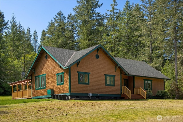 591 Wold Rd, Friday Harbor, WA 98250 - view of front of house with a front yard and a shingled roof