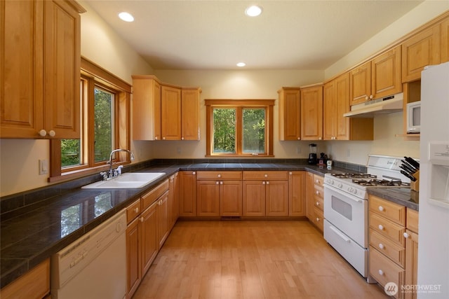 591 Wold Rd, Friday Harbor, WA 98250 - kitchen featuring under cabinet range hood, a sink, white appliances, light wood finished floors, and recessed lighting