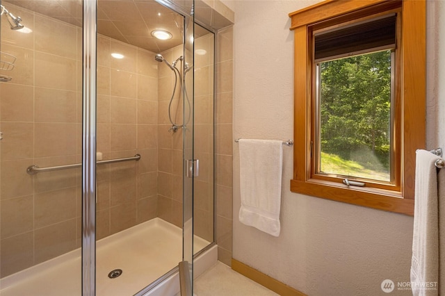 591 Wold Rd, Friday Harbor, WA 98250 - full bath with a stall shower, baseboards, and a textured wall