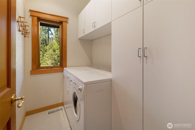591 Wold Rd, Friday Harbor, WA 98250 - washroom with independent washer and dryer, cabinet space, and baseboards