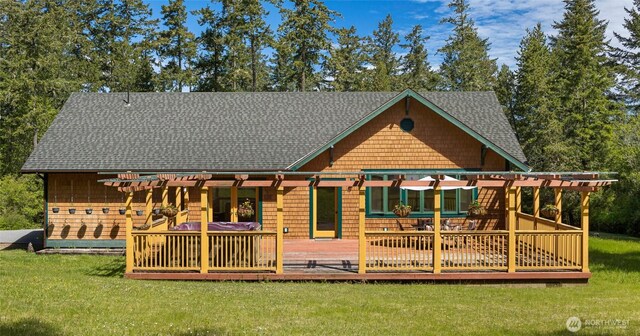 591 Wold Rd, Friday Harbor, WA 98250 - rear view of property with a pergola, a shingled roof, and a yard