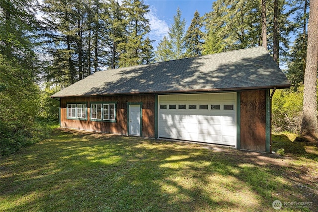 591 Wold Rd, Friday Harbor, WA 98250 - view of front of home with an outdoor structure, a front lawn, and roof with shingles