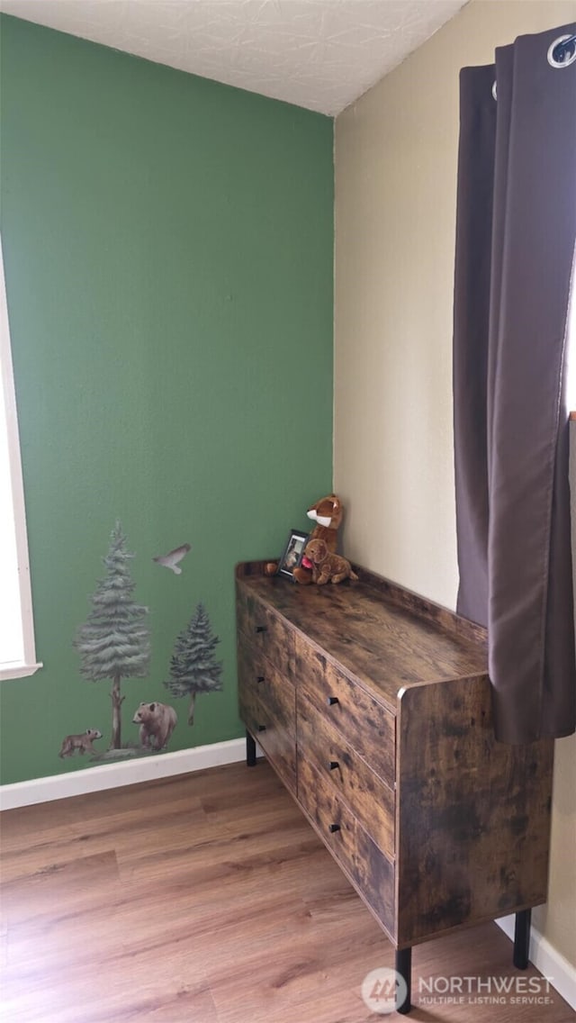 1900 Broadway Ave Unit 2, Hoquiam, WA 98550 - detailed view of wood finished floors and baseboards
