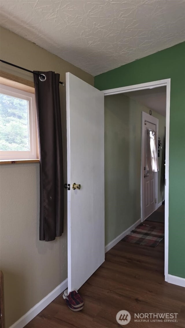 1900 Broadway Ave Unit 2, Hoquiam, WA 98550 - corridor with baseboards and wood finished floors
