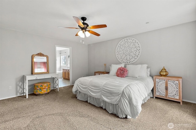 bedroom featuring carpet flooring, ceiling fan, ensuite bath, and baseboards