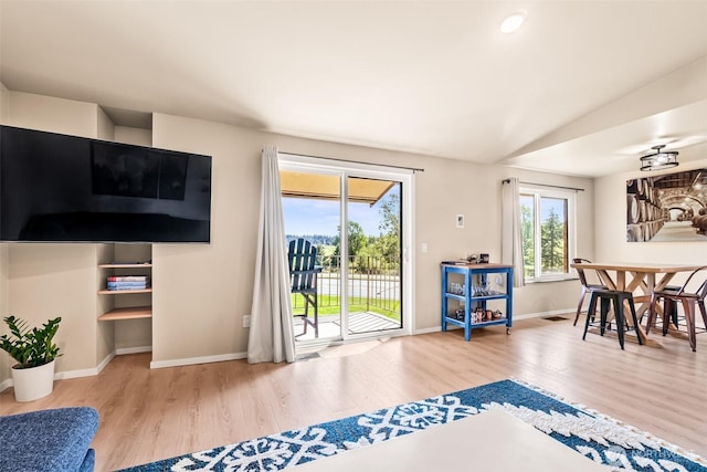 living room featuring wood finished floors and baseboards